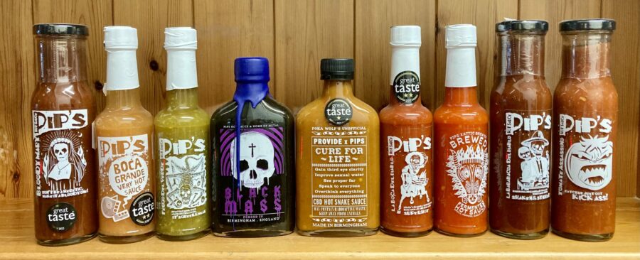 A row of Pip's hot sauce bottles.