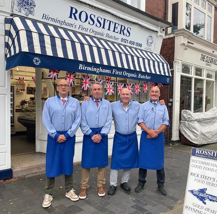 The boys from Rossiters butcher standing outside their shop
