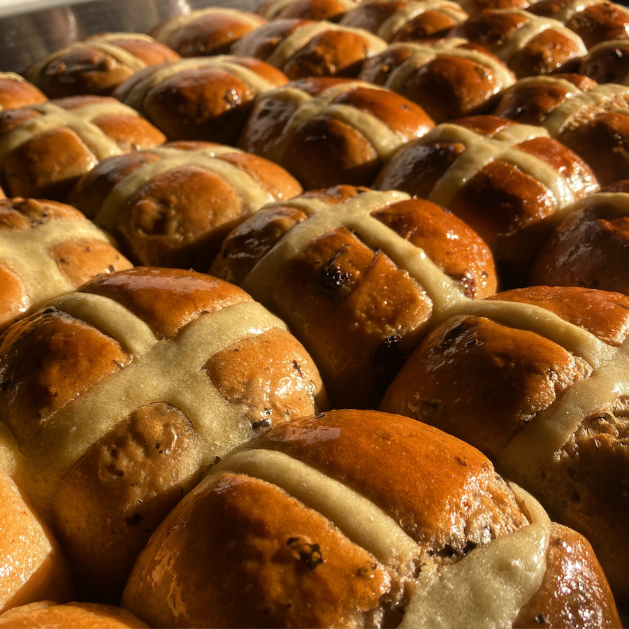 A tray of hot cross buns in the spring morning sunshine.